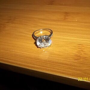 Size 10 1/4 simulated solitaire diamond ring, very large! Silver tone